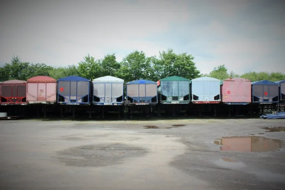 row of old potato bulkers